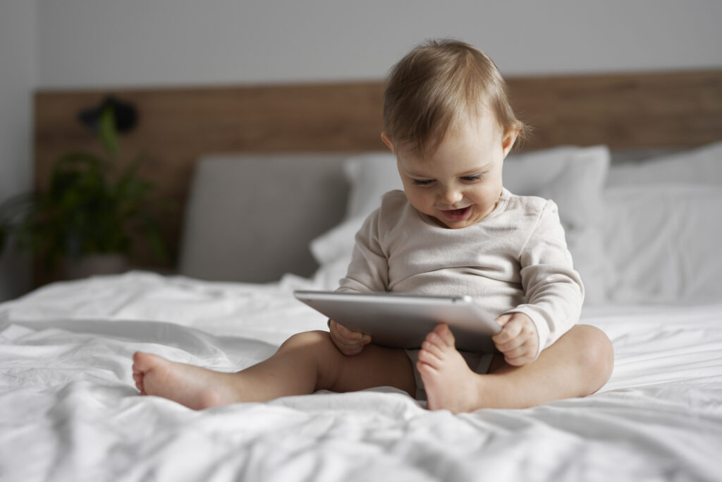 Caucasian little girl using digital tablet at home